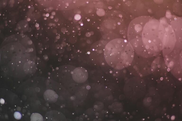 Elegant abstract image with a bokeh effect, displaying sparkles and a blurred background.